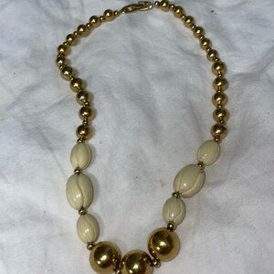Vintage Monet gold tone cream carved bead chain necklace signed fold over clasp